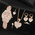 Rose-tone rhinestone watch and matching six-piece jewelry set; box not included.
