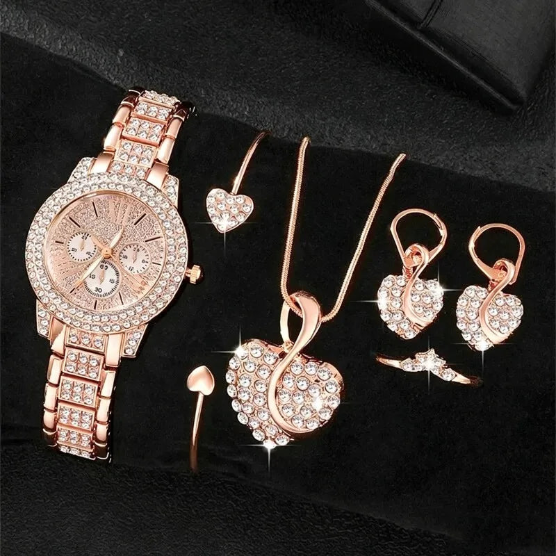 Rose-tone rhinestone watch and matching six-piece jewelry set; box not included.